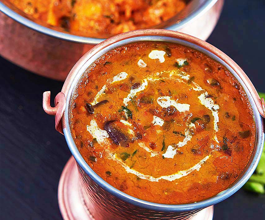 A copper karahi of dal served at Shayona Restaurant