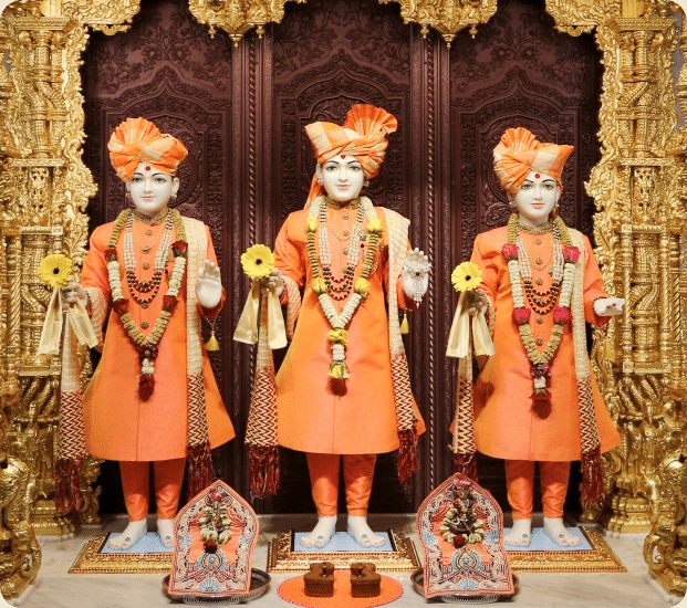 Murtis adorned for darshan in the Mandir's central shrine